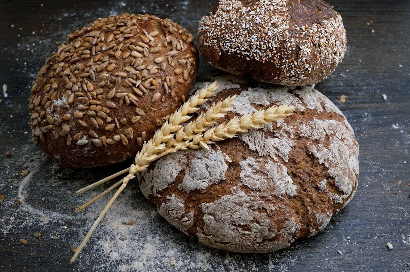 A independent bakery counter stacked with fresh bread